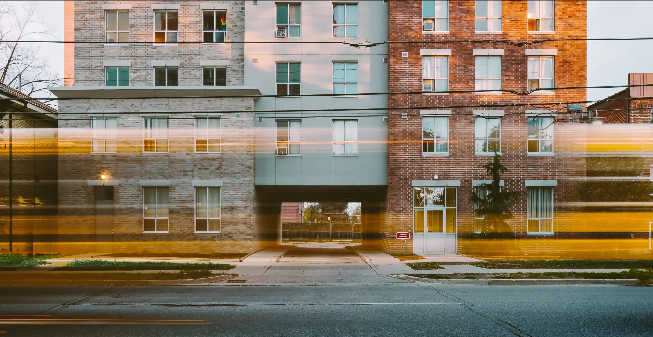 three apartment buildings side by side
